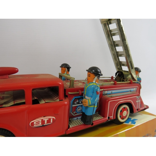 135 - Vintage tin friction fire truck with original box.