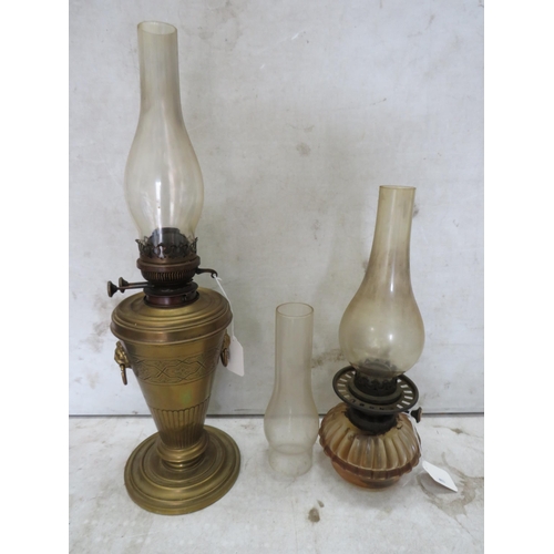 986 - 2 Vintage oil lamps and a spare glass chimney.