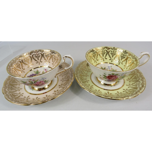 15 - 2 Paragon china cabinet cups and saucer with a fruit and flower design to the inner bowl.