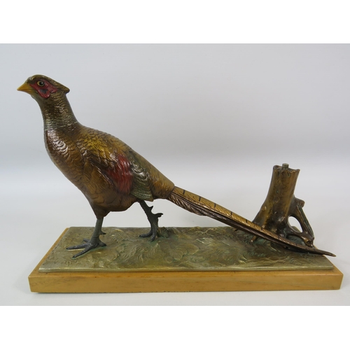 25 - Austrian cold painted spelter Pheasant match striker on a wooden base. It measures 21cm tall and 31.... 