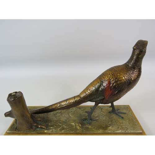 25 - Austrian cold painted spelter Pheasant match striker on a wooden base. It measures 21cm tall and 31.... 