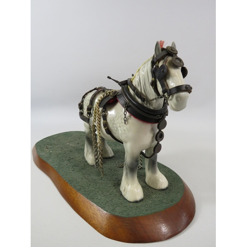 41 - Beswick dapple grey shire model no 818 with harness, standing on a wooden base which measures 20