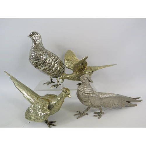 53 - White metal and Lemon gilt Pheasant and Partridge figurines the tallest measures 17.5cm tall.