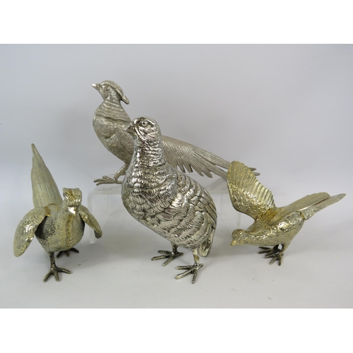 53 - White metal and Lemon gilt Pheasant and Partridge figurines the tallest measures 17.5cm tall.