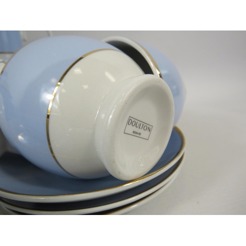 64 - Royal Doulton Blue, white and gold coffee cups, teacups and saucers. More Dishes added after photo.