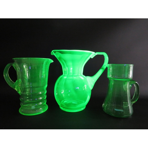 72 - 3 large Uranium glass jugs the tallest measures 22cm tall.