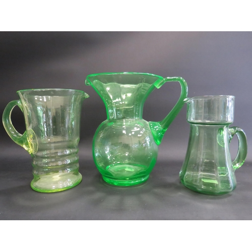 72 - 3 large Uranium glass jugs the tallest measures 22cm tall.