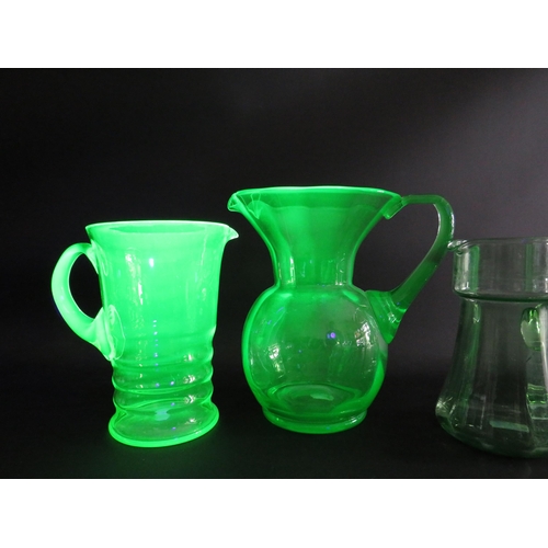 72 - 3 large Uranium glass jugs the tallest measures 22cm tall.