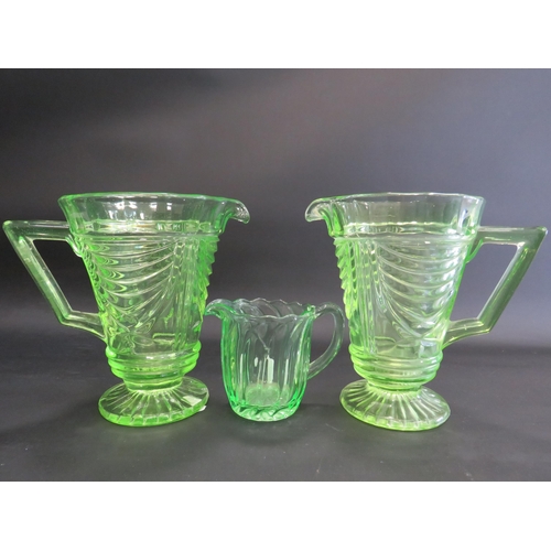 74 - 3 Art deco uranuim glass jugs the tallest measure 7