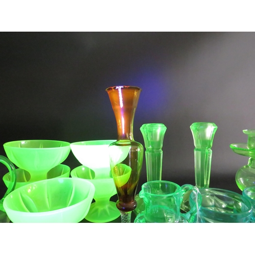 82 - Large selection of various coloured uranium glass, bottles, jugs, candlesticks, bowls etc.