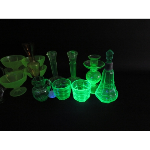 82 - Large selection of various coloured uranium glass, bottles, jugs, candlesticks, bowls etc.