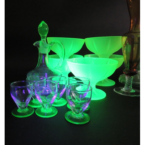 82 - Large selection of various coloured uranium glass, bottles, jugs, candlesticks, bowls etc.