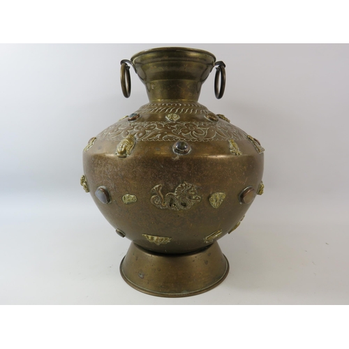 138 - Large Asian brass Buddha temple jar highly decorated with semi precious stone cabochons and Buddist ... 