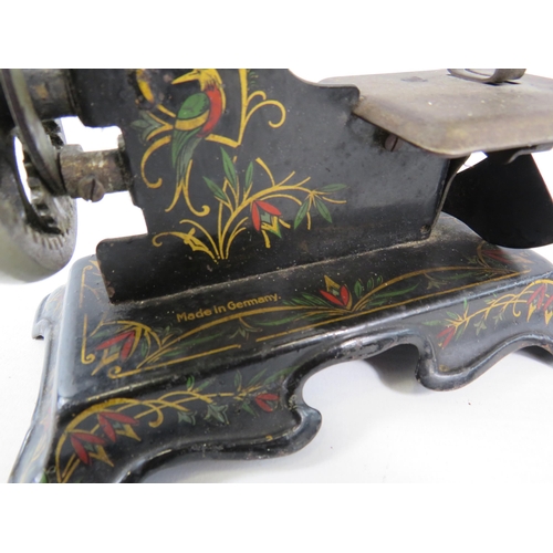 141 - Vintage German tin plate toy sewing machine.