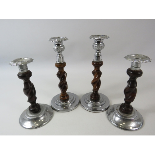 155 - 2 pairs of oak barley twist and white metal candle sticks the tallest pair are 22cm tall.