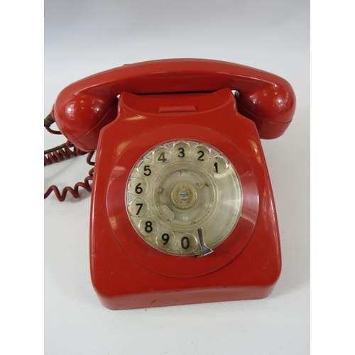 168 - Vintage red rotary dial telephone.