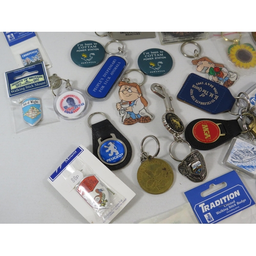 179 - Selection advertising keyrings and walking stick badges.