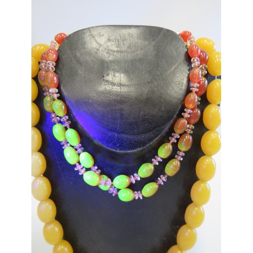 504 - 2 Vintage necklaces Uranium glass and Amber style.