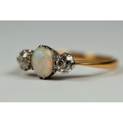 415 - 18ct Gold ring set with a Central Oval Opal flanked by two Sister Diamonds.  Small Finger size Finge... 