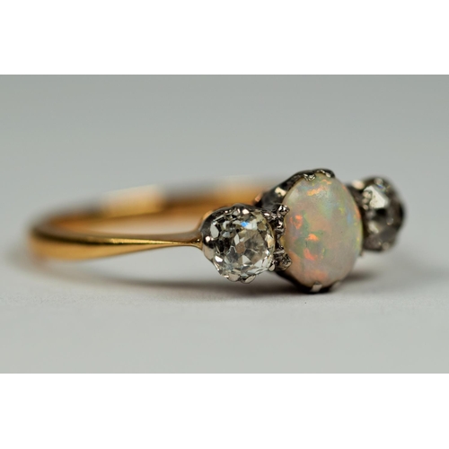 415 - 18ct Gold ring set with a Central Oval Opal flanked by two Sister Diamonds.  Small Finger size Finge... 