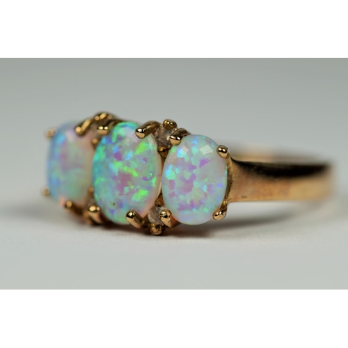 416 - 9ct Yellow Gold Trilogy set Opal ring interspersed with Melee Diamonds. Finger size  O-5   3.6g