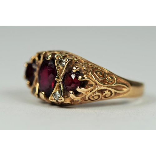 438 - 9ct Yellow Gold Garnet and Gemstone set Gypsy Style Ring (one tiny gemstone missing)   Finger size N... 