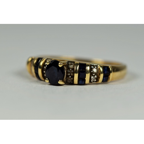 442 - 14ct Yellow Gold sapphire ring with sections of Melee diamonds.   Finger size P-5    2.7g