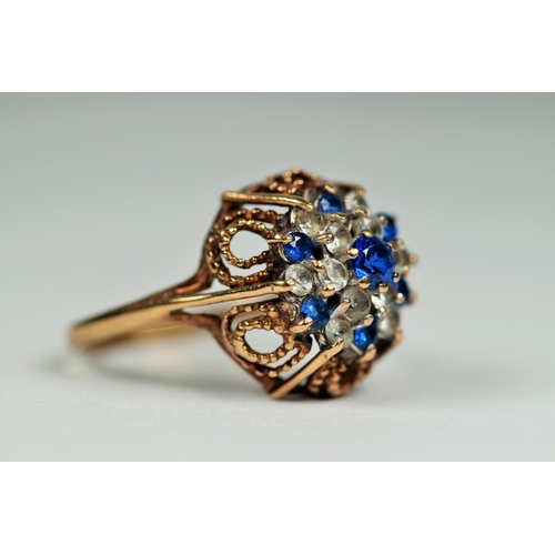 459 - 9ct Yellow Gold Blue and Clear Gemstone ring set in a Filligree setting.  Finger size P      3.5g