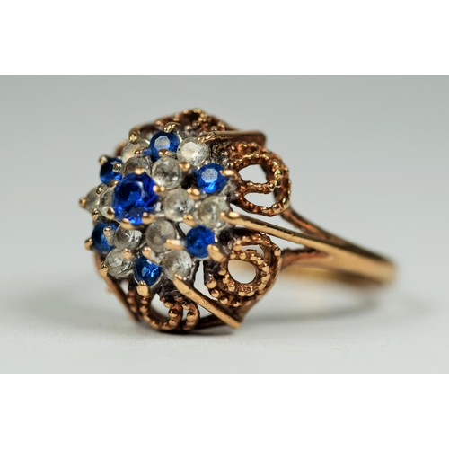 459 - 9ct Yellow Gold Blue and Clear Gemstone ring set in a Filligree setting.  Finger size P      3.5g