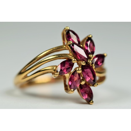 460 - 9ct Yellow Gold Multi Amethyst set ring in a flower pattern.  Finger size R-5  3.0g