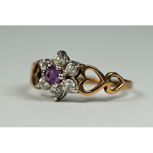 464 - 9ct Yellow Gold Gemstone set flower ring. Twin heart shaped shoulders.   Finger size L-5    1.3g