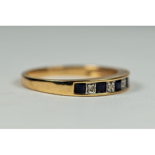 477 - 9ct Yellow Gold Diamond and Sapphire quarter eternity ring. Finger size     1.8g