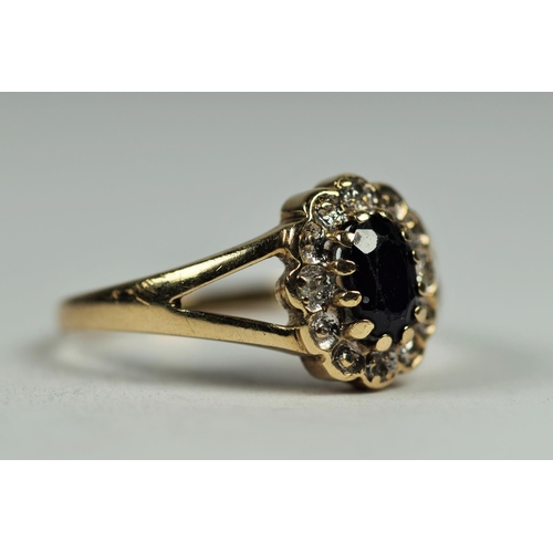 484 - 9ct Yellow Gold ring set with a central Oval Sapphire with Diamond surround.   Finger size K-5    2.... 