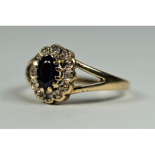 484 - 9ct Yellow Gold ring set with a central Oval Sapphire with Diamond surround.   Finger size K-5    2.... 