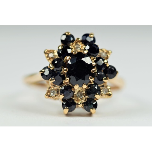 485 - 9ct Yellow Gold Diamond and Sapphire set Statement ring.   Finger size 'T'    4.1g   Hallmarked for ... 