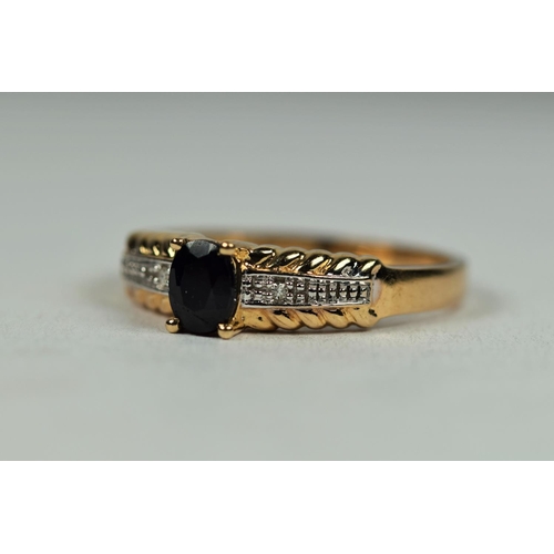 494 - 9ct Yellow Gold Ring set with an oval central Sapphire with Twin banks of Diamonds to Shoulders.  Fi... 