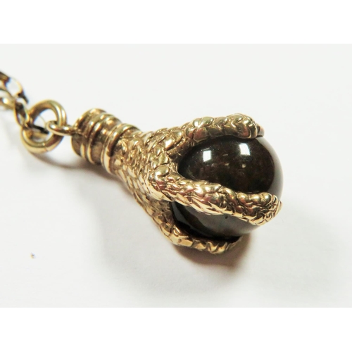 525 - 9ct Yellow Gold Eagle Claw and Tigers Eye pendant set on a 22 inch 9ct Belcher chain. Total Weight 8... 