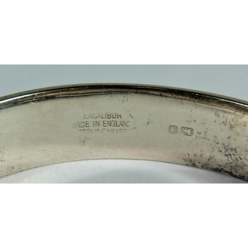 538 - 925 Silver Hallmarked Bangle Bracelet. Scrolled Decoration, safety chain fitted in good order.   20g