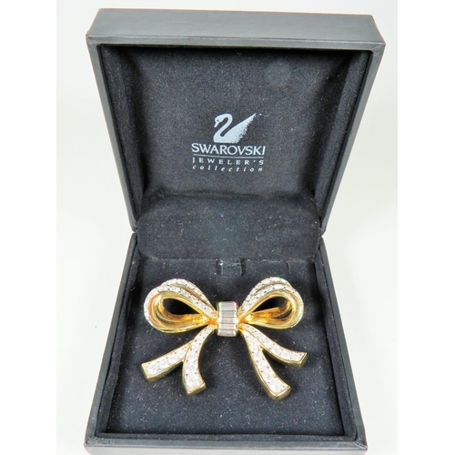 550 - Swarovski Crystal set bow brooch in original display box. 60mm wide.