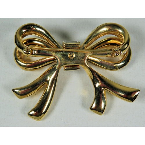 550 - Swarovski Crystal set bow brooch in original display box. 60mm wide.