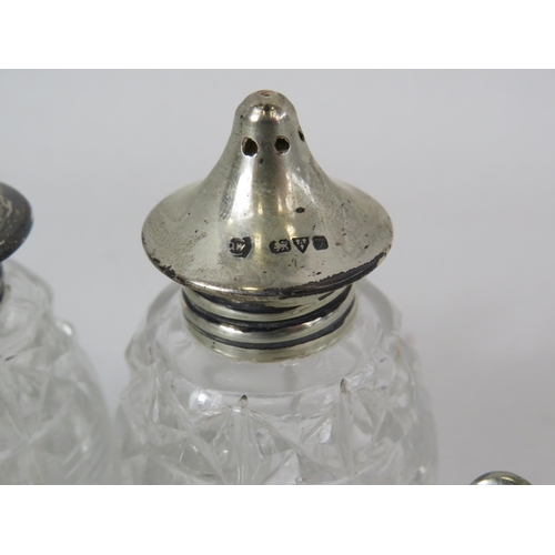 564 - Salt and pepper pots with sterling silver tops, salts etc.