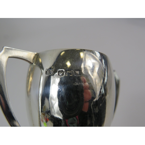 566 - Small sterling silver Trophy hallmarked for Sheffield, 9cm tall & a silver plated presentation plate... 