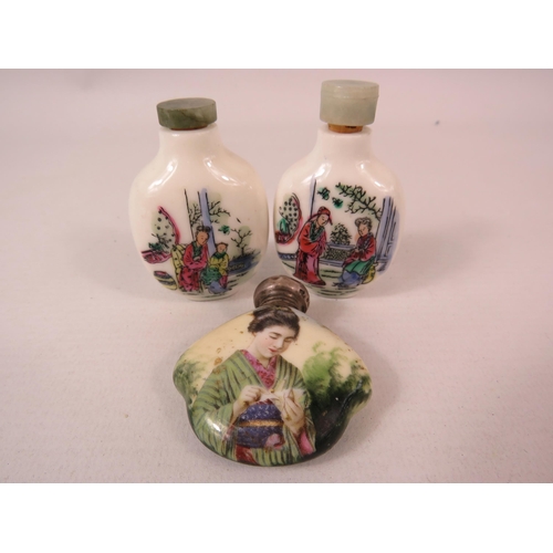 581 - 3 small Oriental scent bottles one having a sterling silver top. The tallest measures 6.5cm.