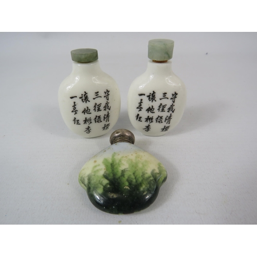 581 - 3 small Oriental scent bottles one having a sterling silver top. The tallest measures 6.5cm.