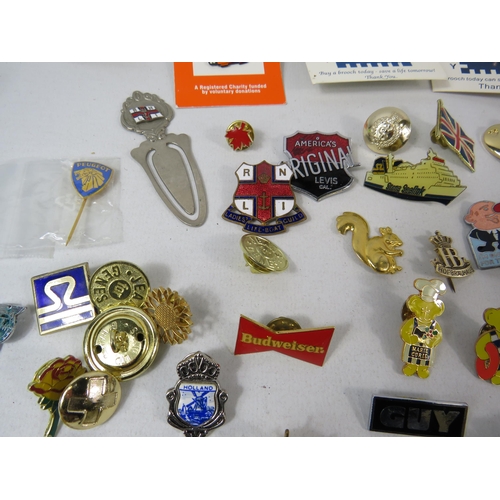 603 - Over 75 various pin badges.