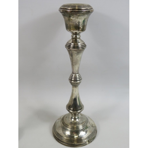 569 - Large and heavy filled Hallmarked Silver candle stick 12 inches tall together with a hallmarked silv... 