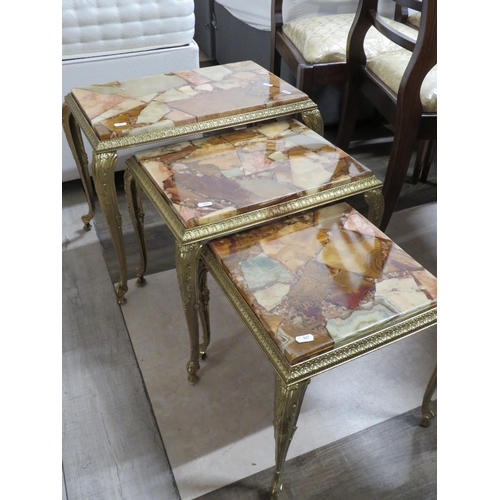 867 - Nest of Three Italian Made stacking tables with Gilt metal frames.  Each table has interesting Glass... 