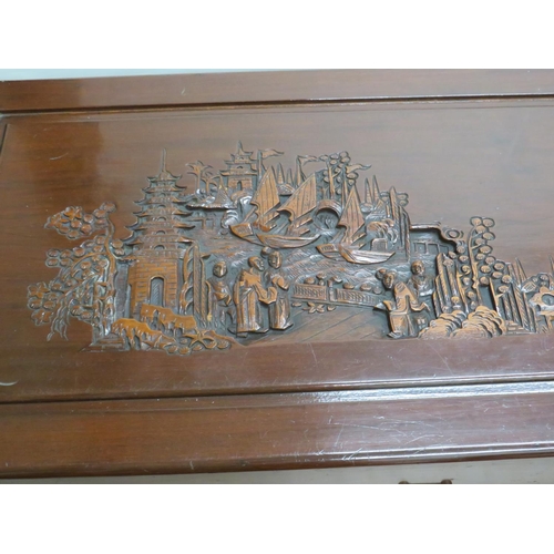 878 - Oriental Hardwood blanket chest with carved decoration showing to tops and sides. Brass lock to fron... 