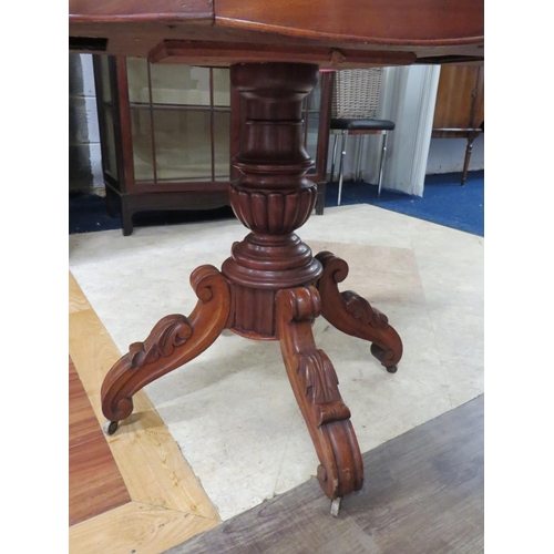 879 - 19th Century Mahogany veneer table raised on four scrolled feet with original castors on turned cent... 