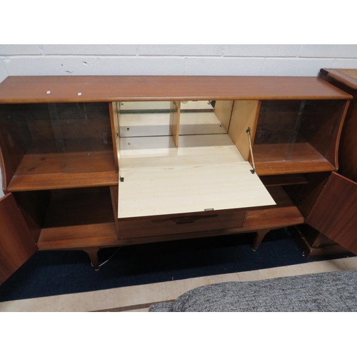 896 - Mid 20th Century Teak Sideboard. Central bank of three graduated drawers, Illuminated central top cu... 